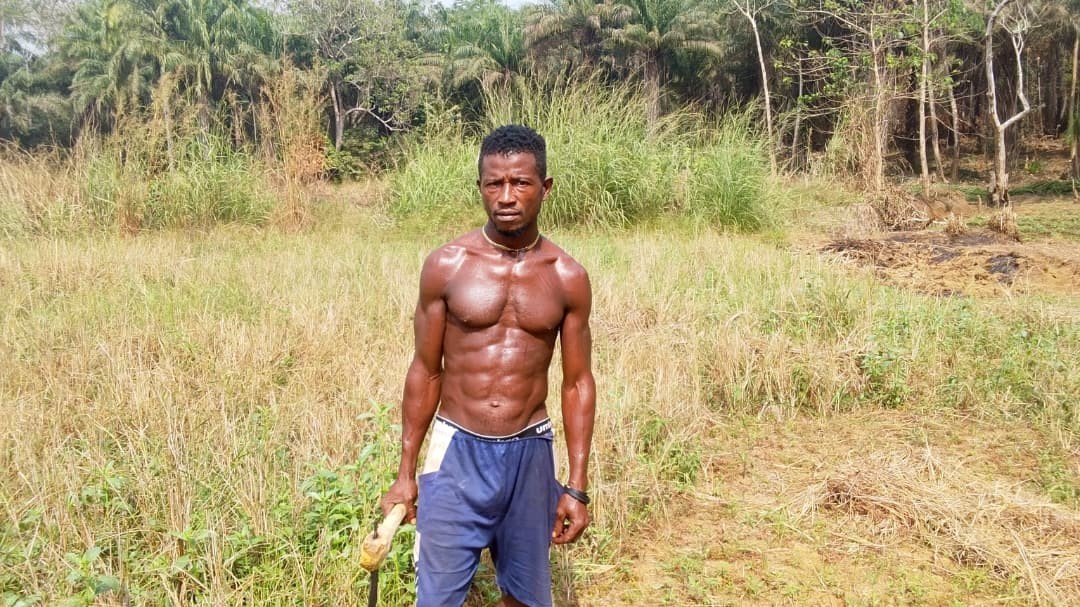 James T. Kamara-one of the affected farmers stands at his farm. Photo Credit: Jonathan Jackson- Komeh for Engage Salone.