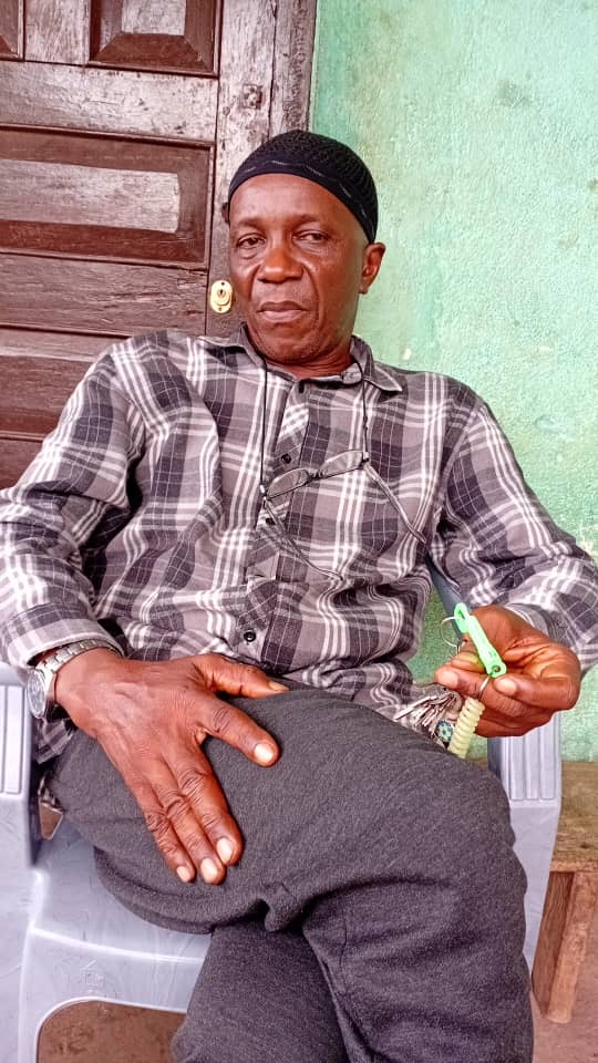 Mohamed Sahr Foryoh sits at his veranda in Koindu Town.
